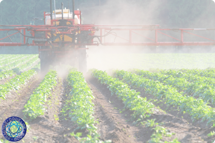 A tractor spraying pesticides over vegetable crop beds.